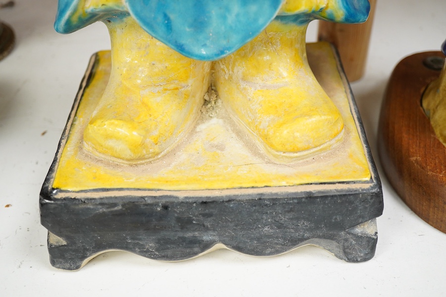 Two Chinese pottery glazed figures to include a Shiwan mudman, largest 48cm high